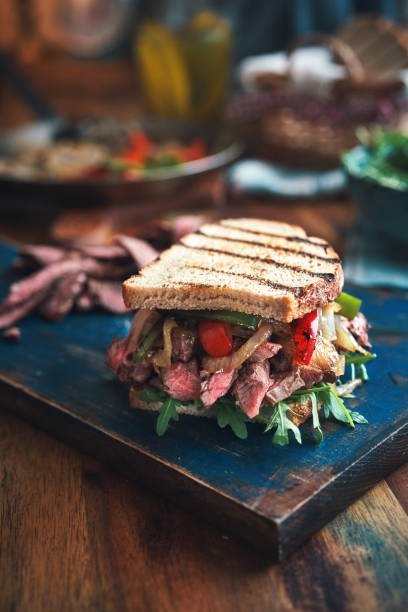 istock Steak Sandwich with Roasted Bell Pepper and Arugula 1301431024