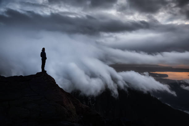 istock Man Hiker on top of a Mountain Peak. 1301431066