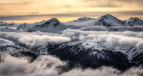 Whistler, British Columbia, Canada. Beautiful Panoramic View of the Canadian Snow Covered Mountain Landscape during a cloudy and vibrant winter day. Artistic Render