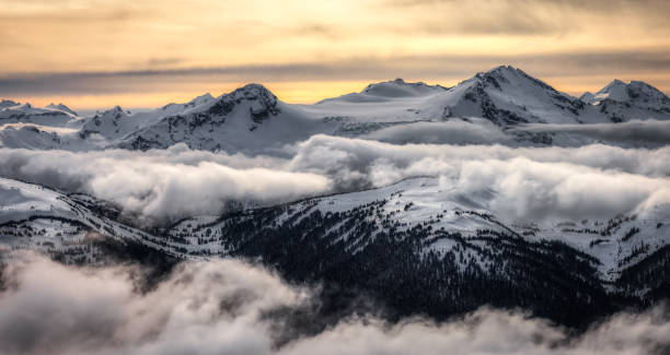 Whistler, British Columbia, Canada. Whistler, British Columbia, Canada. Beautiful Panoramic View of the Canadian Snow Covered Mountain Landscape during a cloudy and vibrant winter day. Artistic Render whistler mountain stock pictures, royalty-free photos & images