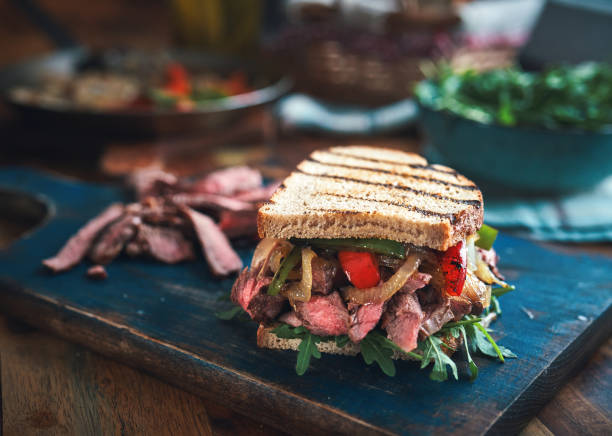 istock Steak Sandwich with Roasted Bell Pepper and Arugula 1301431205