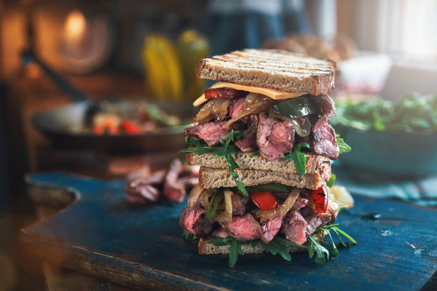 istock Double Steak Sandwich with Roasted Bell Pepper and Arugula 1301431208