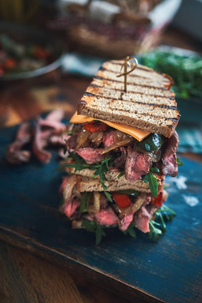istock Double Steak Sandwich with Roasted Bell Pepper and Arugula 1301431295
