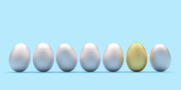 istock Row of Easter silver eggs with one golden egg on blue. 1301432192