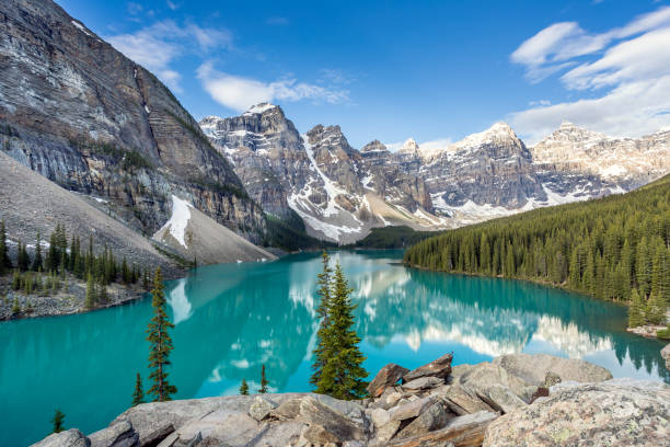 Moraine Lake at sunrise in June, Banff National Park, Canada Moraine Lake at sunrise in June, Banff National Park, Canada moraine lake photos stock pictures, royalty-free photos & images