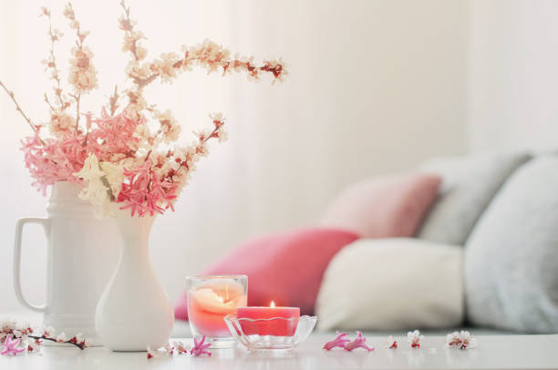 istock spring pink flowers in vase on white interior 1301435634