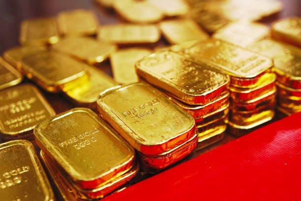 istock Close up stack of gold bars decorate near red envelope 1301436876