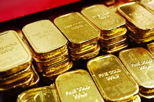 istock Close up stack of gold bars decorate near red envelope 1301436886