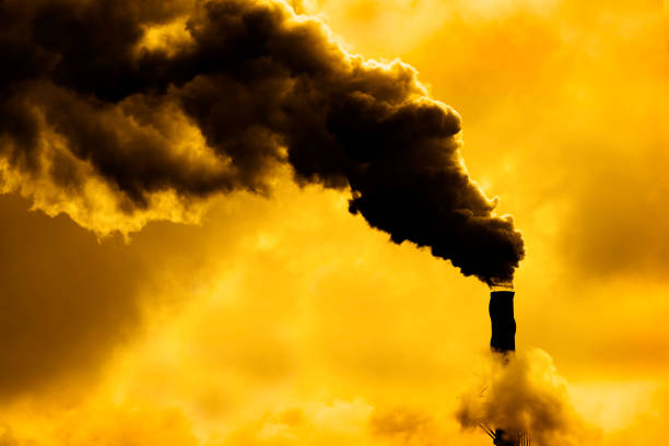 istock Pollution rising from factory smoke smokestack chimney environment 1301438136