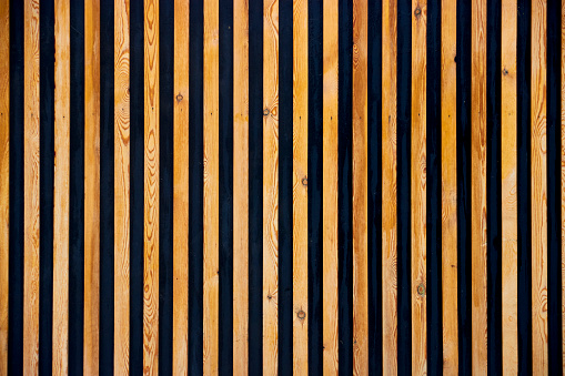 background of vertical wooden slats for wall decoration . High quality photo