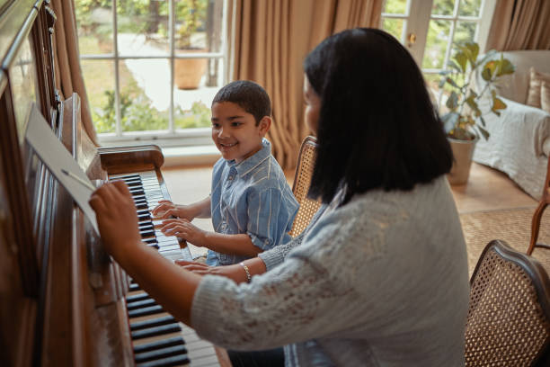 istock He really enjoys playing the piano 1301439803