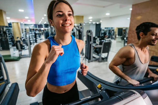 istock Woman running on treadmill in gym 1301442094