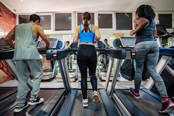 istock People running on treadmill in gym 1301442368