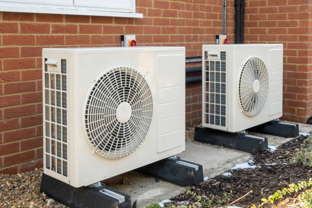 istock Two air source heat pumps on a modern house 1301442545