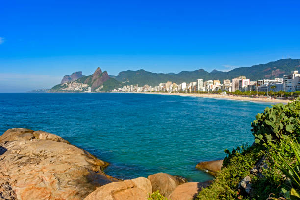 istock Ipanema beach in Rio de Janeiro with mountains 1301444102