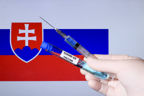 istock Hand holding syringe with covid vaccine 1301444959