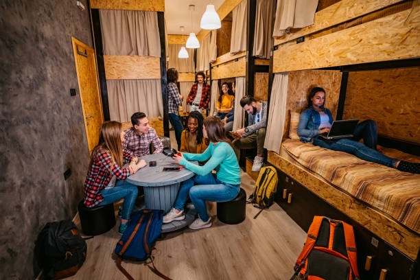 istock Friends talking in hostel room 1301445040