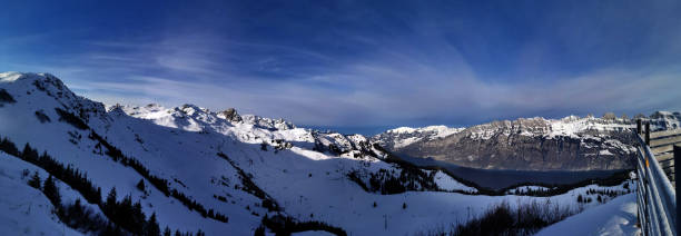 istock snow white mountain range in switzerland 1301448754