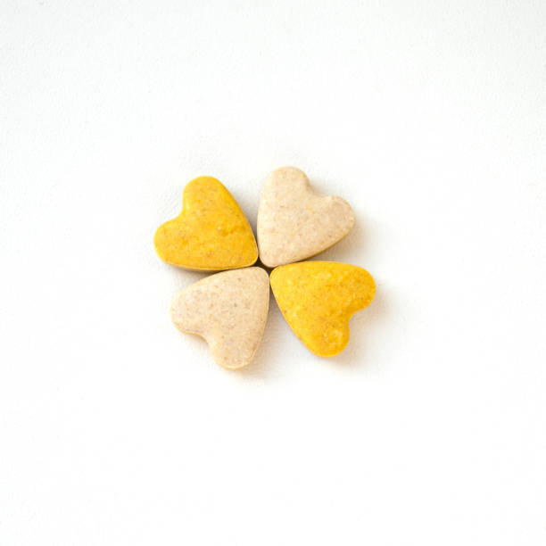 Abstract flower with four heart shaped petals on light background