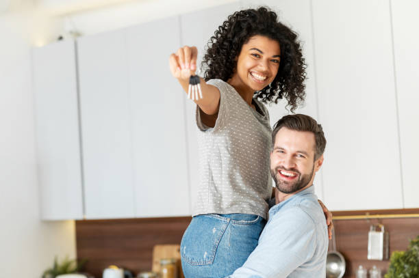 istock Multiracial couple moving in a new house 1301450330