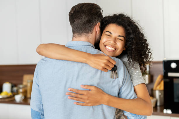 istock Interracial couple celebrating the relocation 1301450417