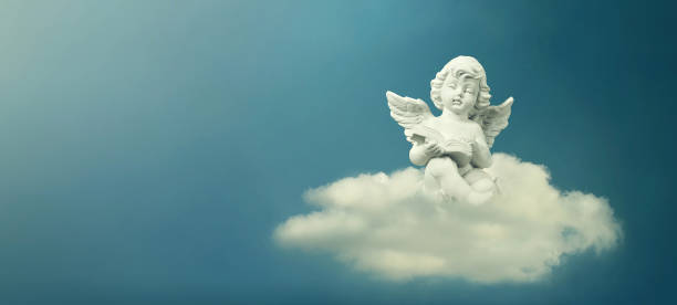 istock Little angel sitting on the cloud and reading book 1301452281