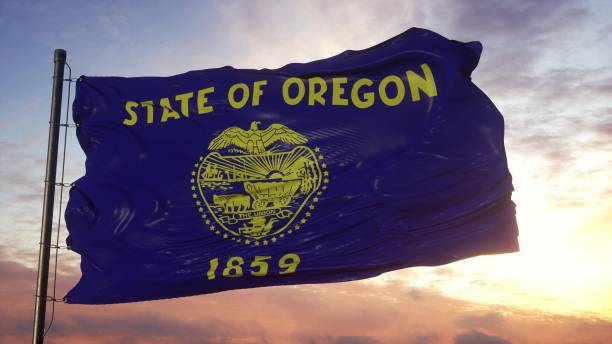 Flag of Oregon waving in the wind against deep beautiful sky. 3d illustration Flag of Oregon waving in the wind against deep beautiful sky. 3d illustration. oregon state university stock pictures, royalty-free photos & images
