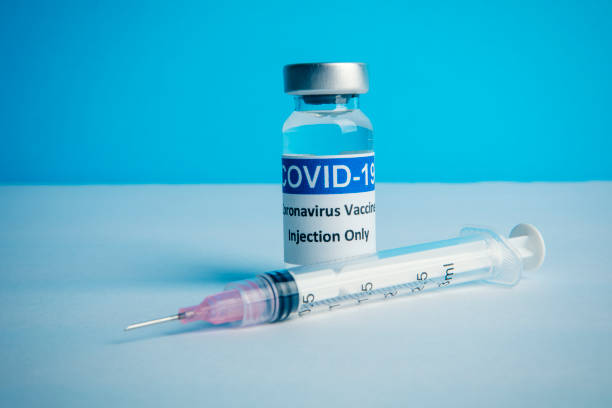 istock Covid Vaccine With Syringe 1301456448