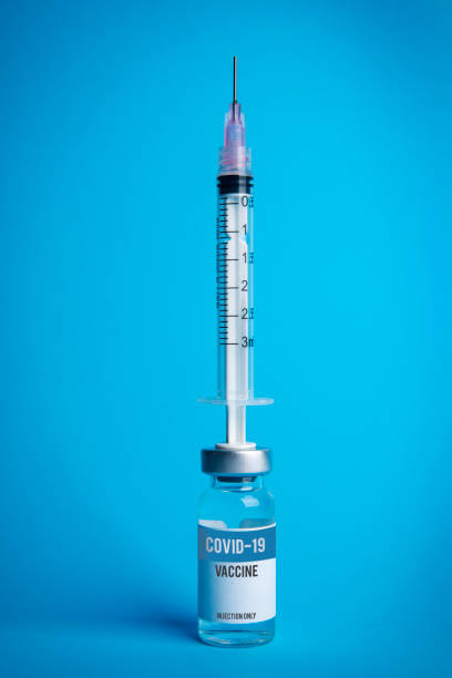 istock Covid-19 Vaccine With Syringe on Vial 1301456766
