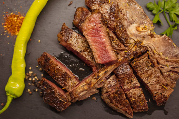 istock Top view of medium roasted t-bone steak. 1301457759