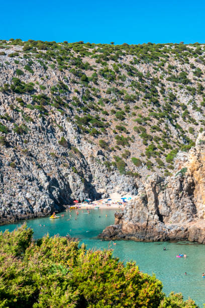 istock crystal clear and tropical water at Cala Domestica beach 1301458350