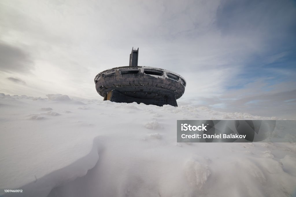 Buzludzha monument, UFO. Winter mood. Soviet monument in Bulgaria, historical and cultural architectural heritage, abandoned, partly destroyed, symbol of Communism. Building Exterior Stock Photo