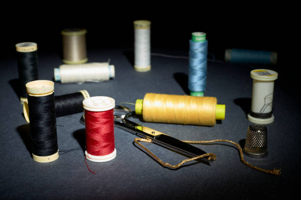 istock Red and other colored thread, buttons and sewing supplies 1301460563