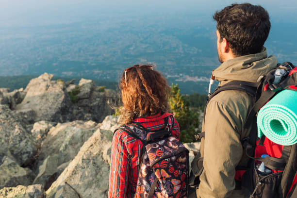 istock Tourists couple looking at view 1301465733
