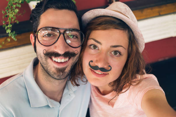 istock Young attractive couple making selfie 1301465755