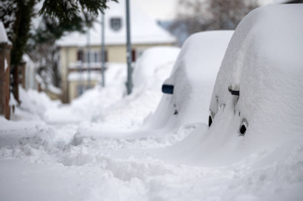 istock Cars in winter covered with snow 1301466831