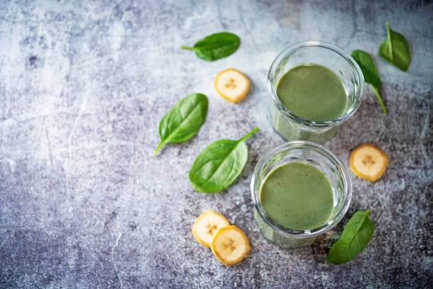istock Spinach banana smoothie in a glass 1301468086