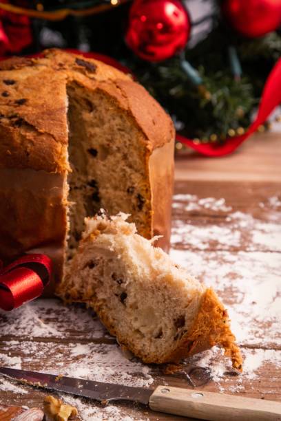 istock traditional christmas panettone on wooden table with decorations 1301468441