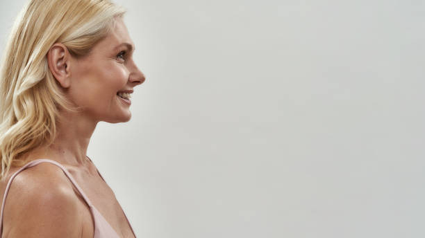 istock Happy middle aged caucasian woman standing sideways 1301468444