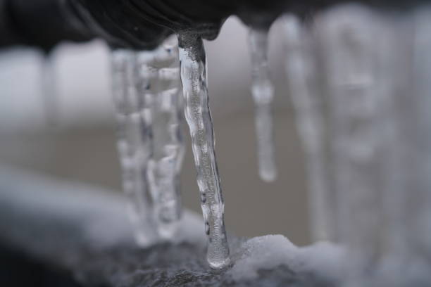 istock frozen ice on a railing in winter, icicles 1301469226