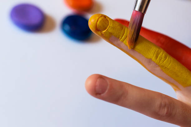 istock Person water painting on their hands. 1301469244