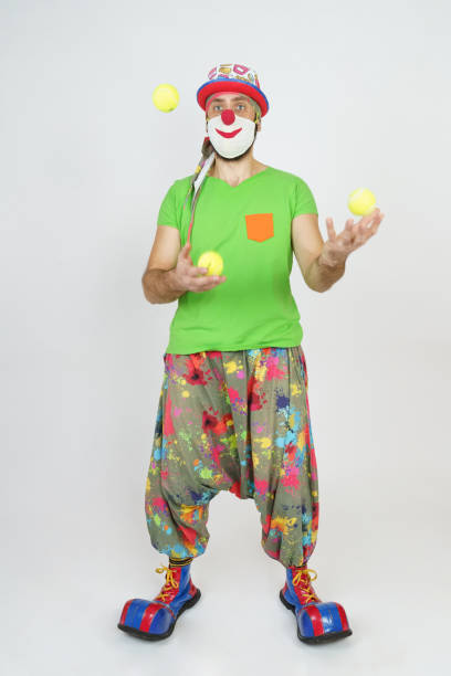 istock The clown juggles balls. Isolated on white 1301469283