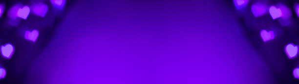 istock Banner of purple and violet lights makes hears shape bokeh 1301469482