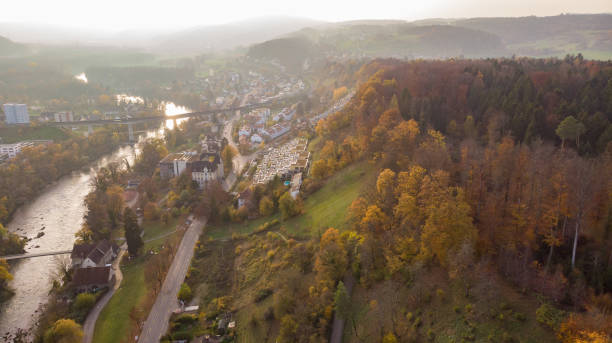 Drone view of city Brugg south-west and Umiken with Aare river. Drone view of city Brugg south-west and Umiken with Aare river, residential districts, bridge and old mill, famous train viaduct in canton Aargau in Switzerland. Town situated on feet of Tafeljura. aargau canton photos stock pictures, royalty-free photos & images