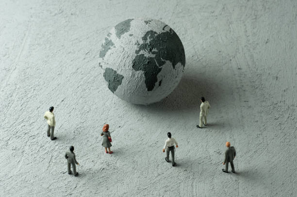 Globe 3 Businessman/Politician figurines examine a concrete globe (Europe, Africa) diplomacy photos stock pictures, royalty-free photos & images