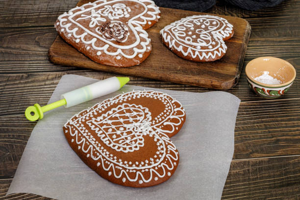 Gingerbread cookies decorated for Valentine Day on the table.
