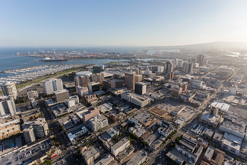 Aerial view of downtown streets, buildings and coastline in Long Beach, California.