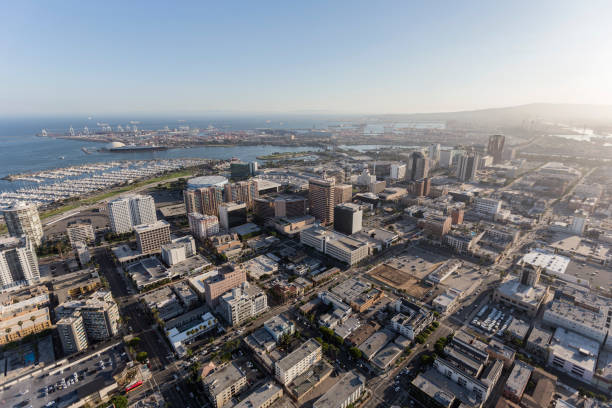 Long Beach California Aerial View Aerial view of downtown streets, buildings and coastline in Long Beach, California. long beach california photos stock pictures, royalty-free photos & images
