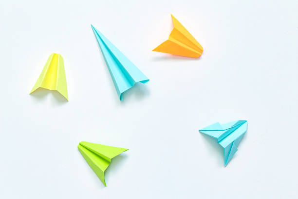 istock Paper plane on white background. Leadership and Business competition concepts. Copy space 1301474596