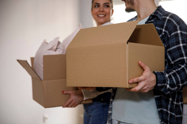 istock Happy couple moving in together 1301476518
